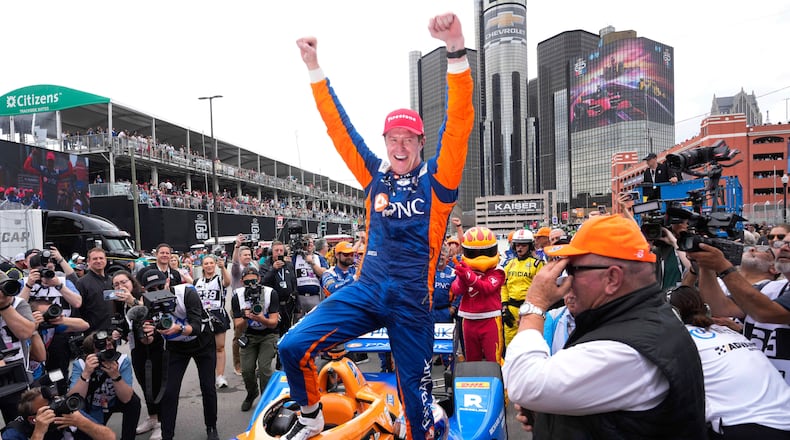 FILE - Scott Dixon celebrates winning the IndyCar Detroit Grand Prix auto race in Detroit, Sunday, June 2, 2024. (AP Photo/Paul Sancya, File)