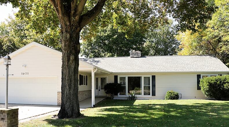 The home offers about 1,800 sq. ft. of living space with 3 or 4 bedrooms and 2 full bathrooms. The ranch sits on 0.72 acres and has a 2-car garage with a wide driveway and covered front entry. CONTRIBUTED PHOTO BY KATHY TYLER
