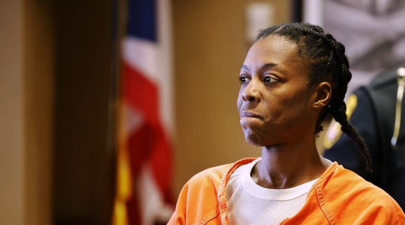 Mia Harris, who is charged with multiple counts of felonious assault for allegedly shooting her infant granddaughter in the head last month at a Liberty Twp residence, pleaded not guilty by reason of insanity during arraignment Tuesday in Butler County Common Pleas Court. NICK GRAHAM/STAFF