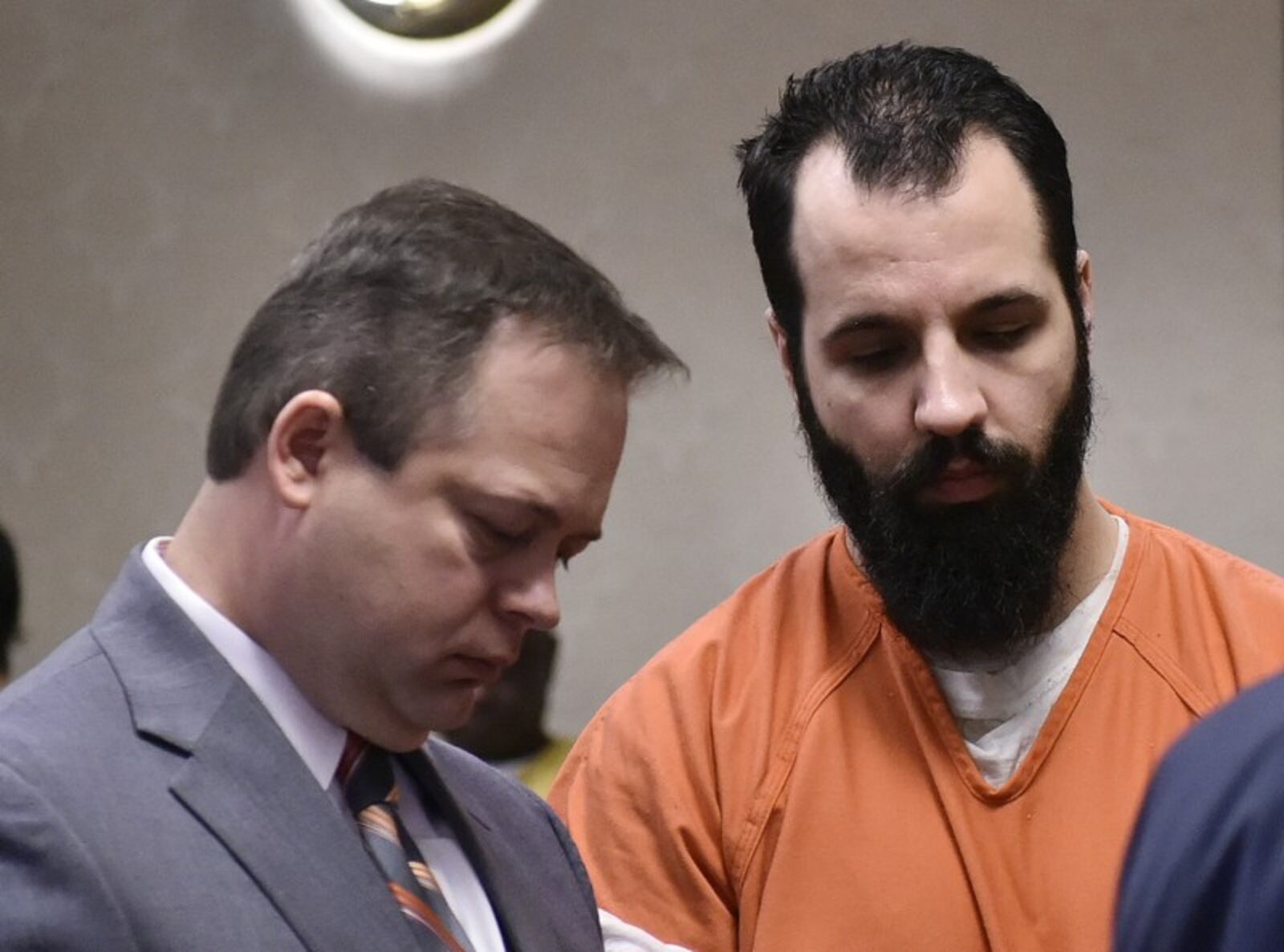 Michael Stouse, charged in the murder of Ellie Weik, with attorney Kyle Rapier at a pre-trial hearing in December in Butler County Common Pleas Court. NICK GRAHAM/STAFF