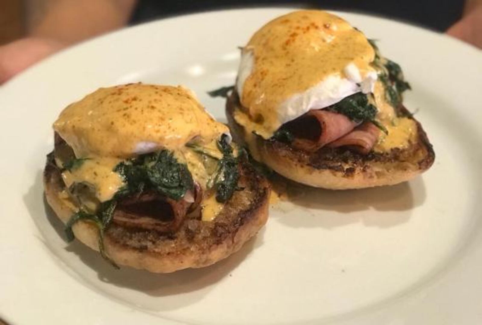 Fried Bologna Benedict with Smoked Tomato Hollandaise. The bologna, as well as the English muffins, are made in house.