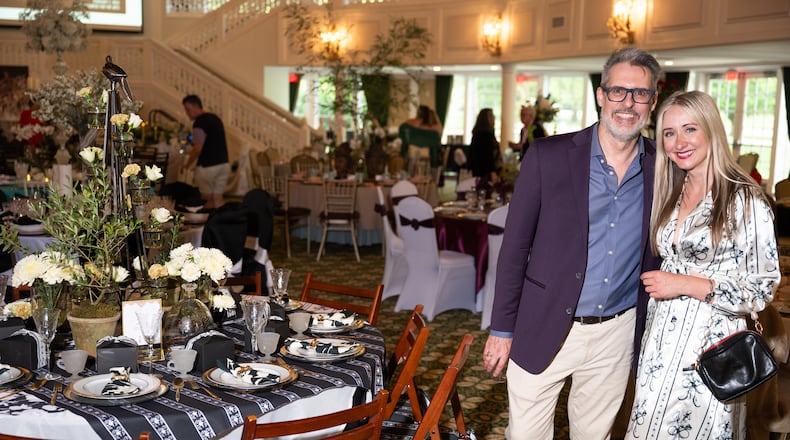 Olivia Richardson and interior designer Jon Blunt at the Dayton Dines by Design event at the Eichelberger Pavilion. Richardson contributed a tablescape featuring her original textile designs. She is wearing a dress made of her own pattern. CONTRIBUTED PHOTO