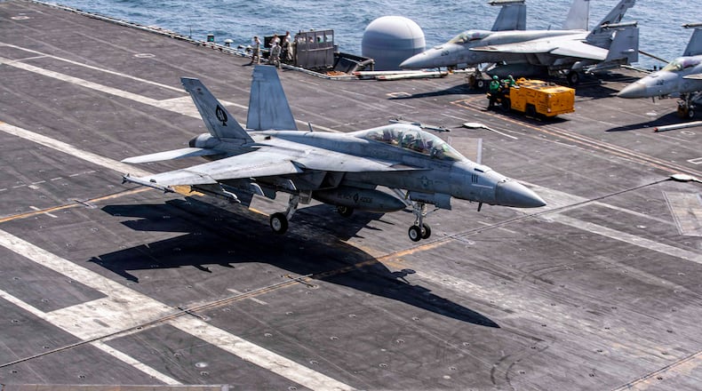 This image provided by U.S. Central Command shows a F/A-18E Super Hornet makes an arrested landing on the USS Abraham Lincoln (CVN 72) after a mission in support of Operation Epic Fury, on Saturday, Feb. 28, 2026. (U.S. Navy via AP)