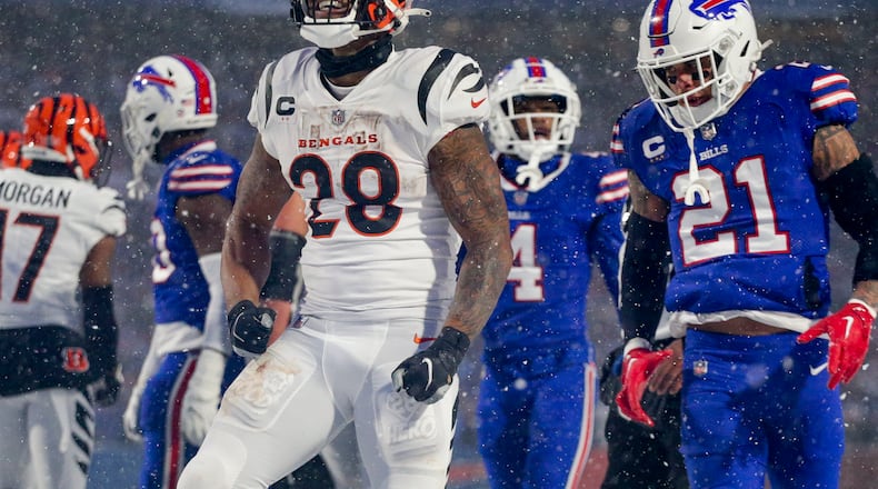 Cincinnati Bengals running back Joe Mixon (28) reacts after carrying the ball against the Buffalo Bills during the third quarter of an NFL division round football game, Sunday, Jan. 22, 2023, in Orchard Park, N.Y. (AP Photo/Joshua Bessex)