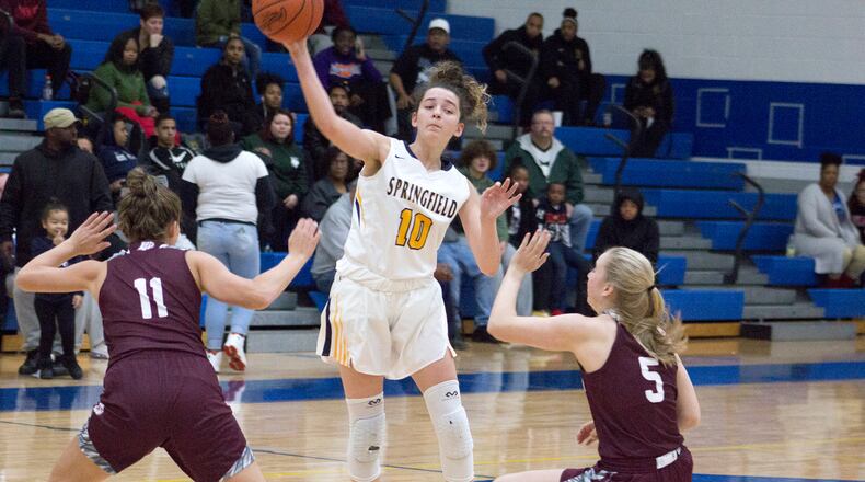Springfield sophomore guard Mickayla Perdue passes over a double-team. Jeff Gilbert/CONTRIBUTED