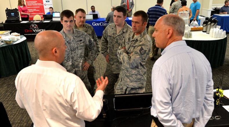 Airmen attending a 2017 Tech Expo participate in a discussion with a technology vendor. Tech Expos connect government and industry to collaborate on mission requirements and technology solutions. (Courtesy photo)