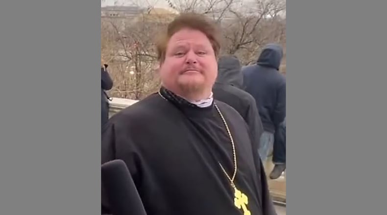 The Rev. Mark Hodges, an Orthodox priest from Lima, was suspended from the priesthood after joining in the protest Jan. 6 at the U.S. Capitol, where he is seen in this still image taken from video posted to social media.