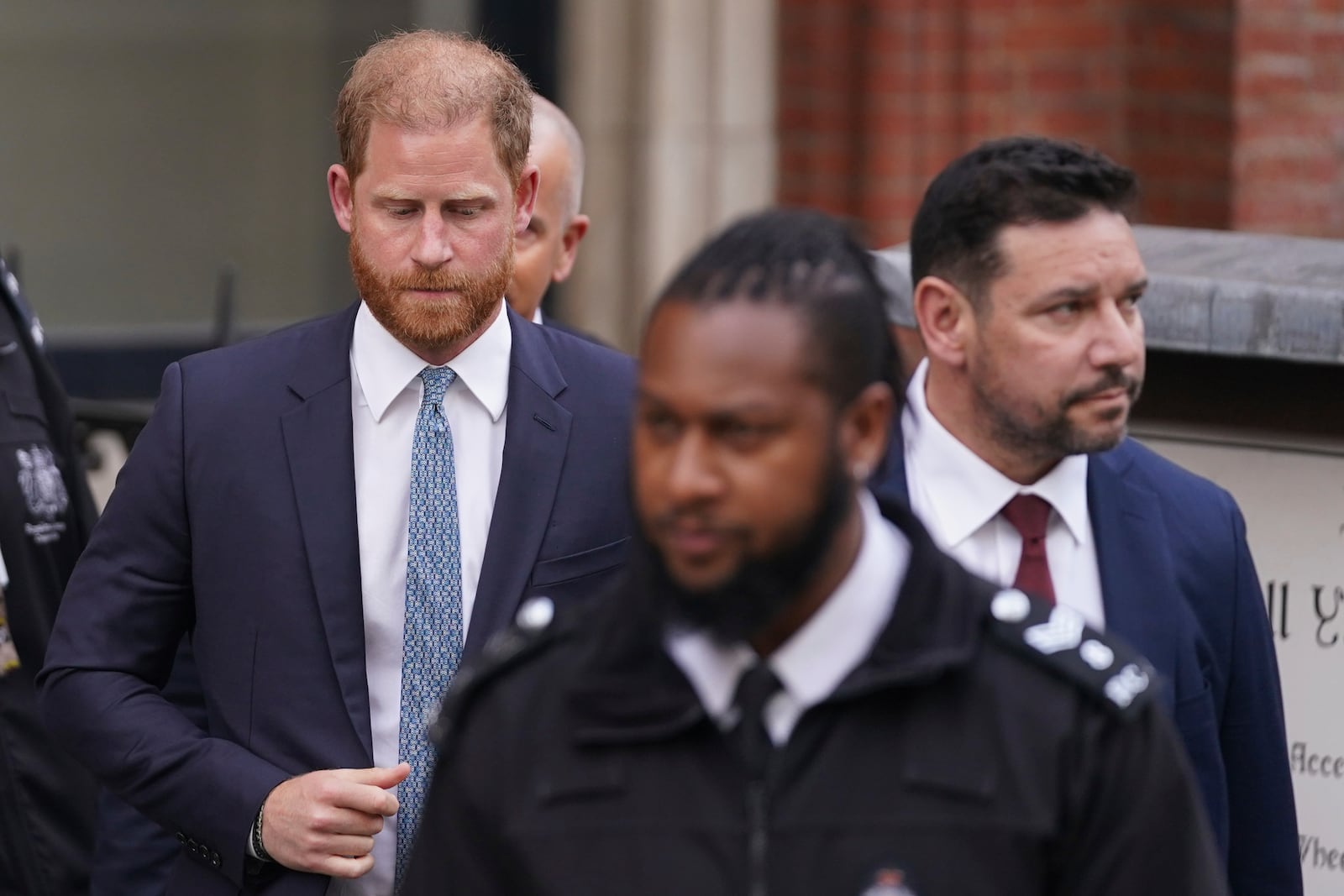 Britain's Prince Harry looks down as he leaves the Royal Courts of Justice in London, Tuesday, April 8, 2025. (AP Photo/Alberto Pezzali)