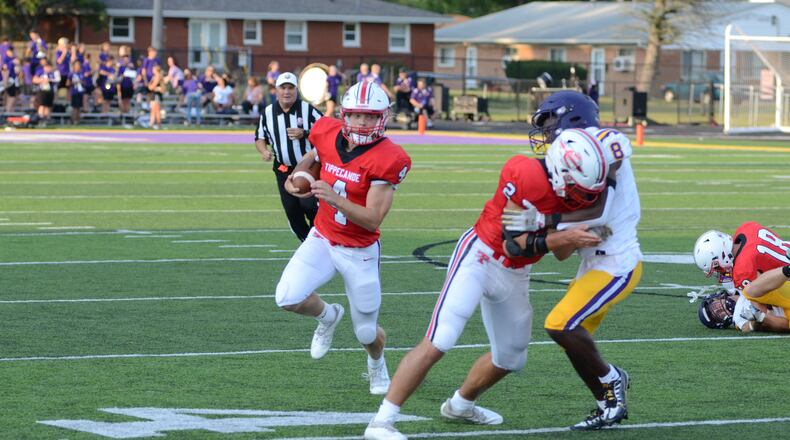 Tipp's Liam Poronsky looks for room to run in Friday night's season-opening game vs. Bellbrook. Eric Frantz/CONTRIBUTED