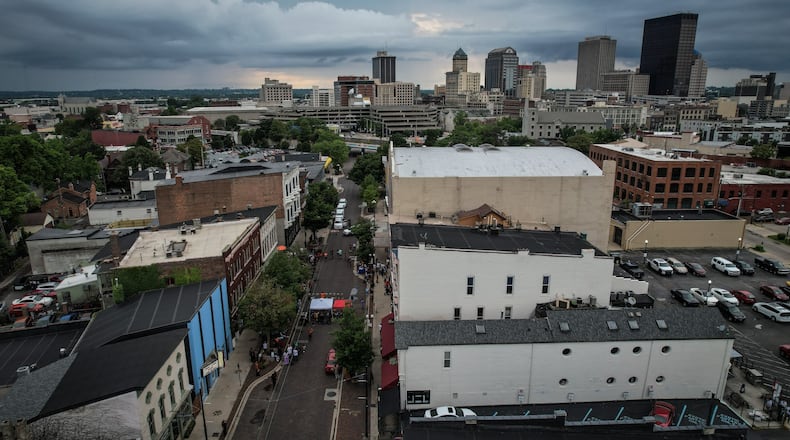 This is a drone photograph looking northwest at Fifth Street, lower left, to downtown Dayton. The third anniversary of the Oregon District mass shooting was held Thursday, Aug. 4, 2022.  JIM NOELKER/STAFF