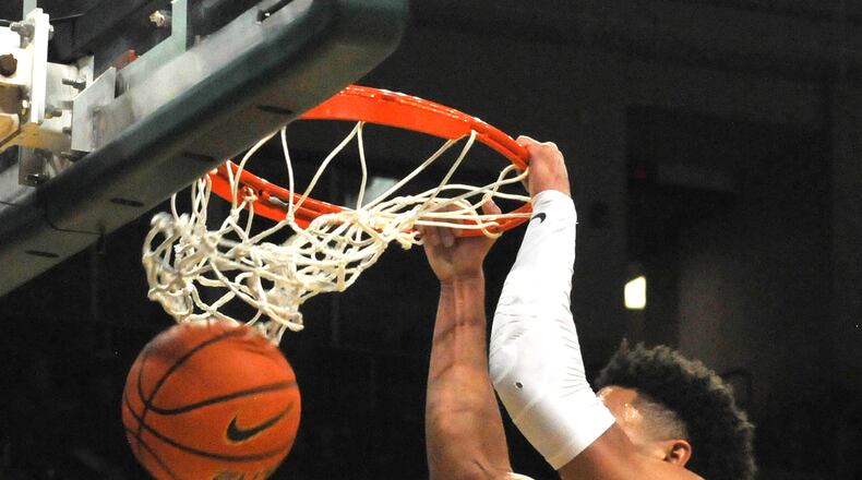 Wright State's Tanner Holden dunks the ball during the first half of a nonconference game against visiting Miami on Tuesday, Dec. 19, 2023. DAVID A. MOODIE/CONTRIBUTING PHOTOGRAPHER