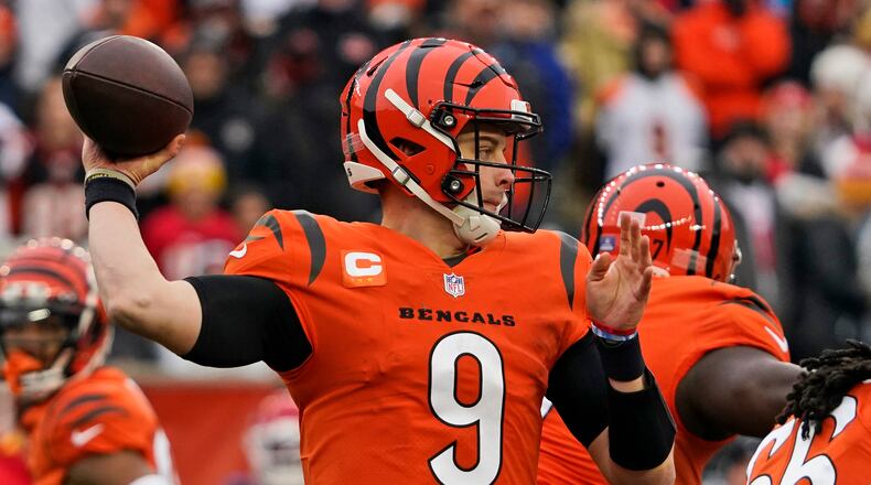Cincinnati Bengals quarterback Joe Burrow looks to throw during the first half of an NFL football game against the Kansas City Chiefs, Sunday, Jan. 2, 2022, in Cincinnati. (AP Photo/Jeff Dean)