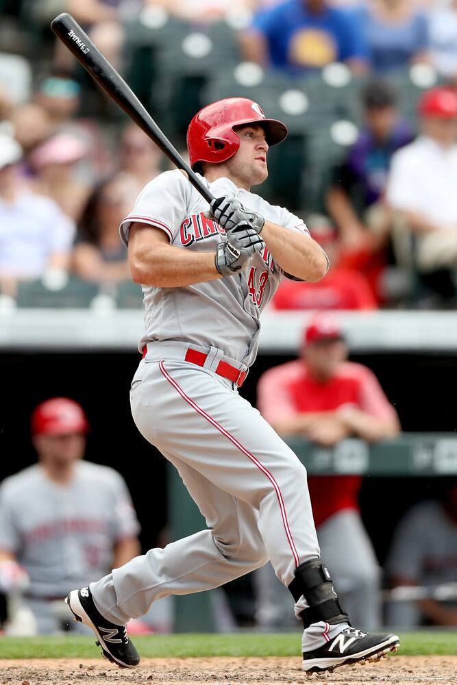 PHOTOS: Reds pile up 13 hits, beat the Rockies