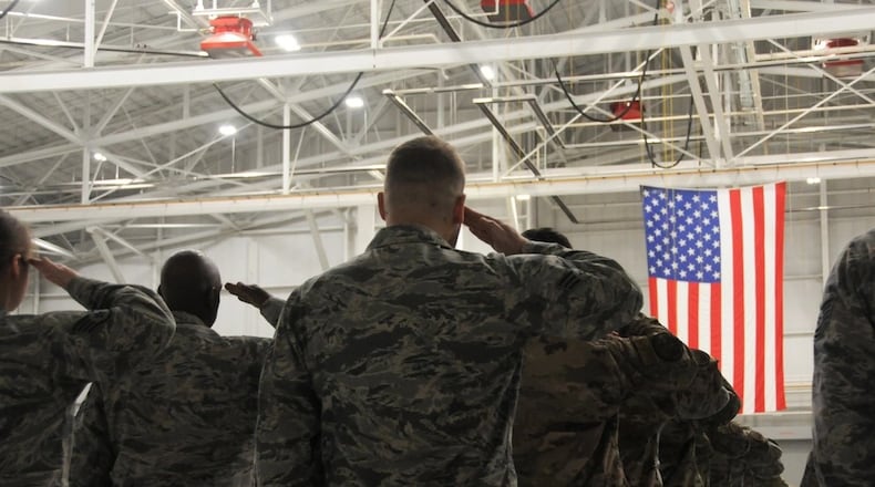 Airmen salute at a April 2020 change of command ceremony for the 445th Airlift Wing at Wright-Patterson Air Force Base. Air Force photo.