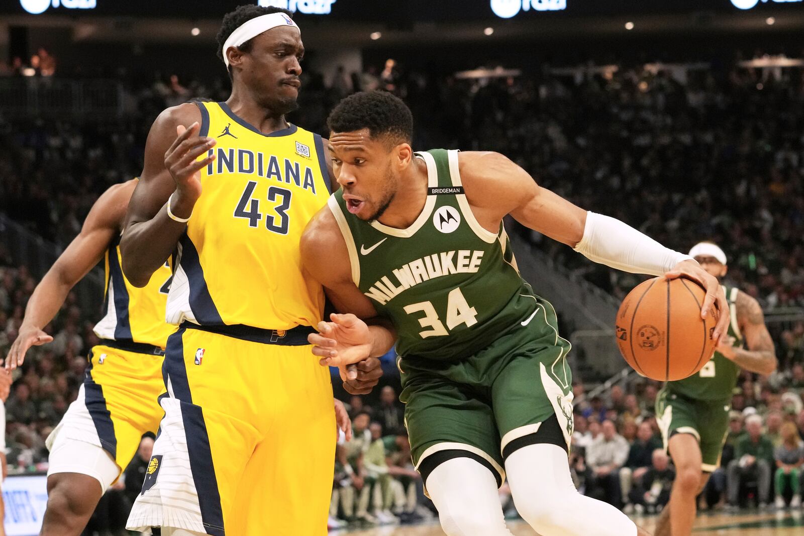Milwaukee Bucks forward Giannis Antetokounmpo, right, drives against Indiana Pacers forward Pascal Siakam (43) during the first half in Game 3 of an NBA basketball first-round playoff series Friday, April 25, 2025, in Milwaukee. (AP Photo/Nam Y. Huh)