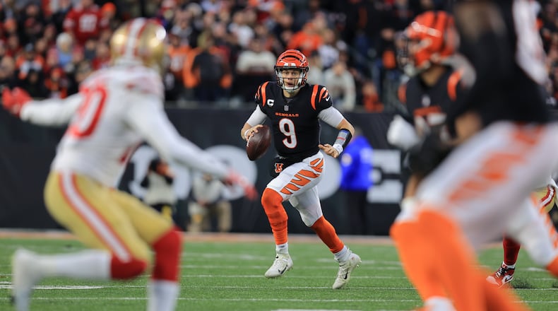 Cincinnati Bengals quarterback Joe Burrow (9) runs during the first half of an NFL football game against the San Francisco 49ers, Sunday, Dec. 12, 2021, in Cincinnati. (AP Photo/Aaron Doster)