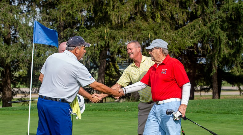 Jay Donnelly (front left), John Savard (front right), Brian Gauthier (back right) and Tim Cotton (back left) shake hands after the Ryder Cup’s third round Oct. 11 at Wright-Patterson Air Force Base. A total of 44 players competed in the three-day tournament at Prairie Trace Golf Course. (U.S. Air Force photo by Senior Airman Jack Gardner)