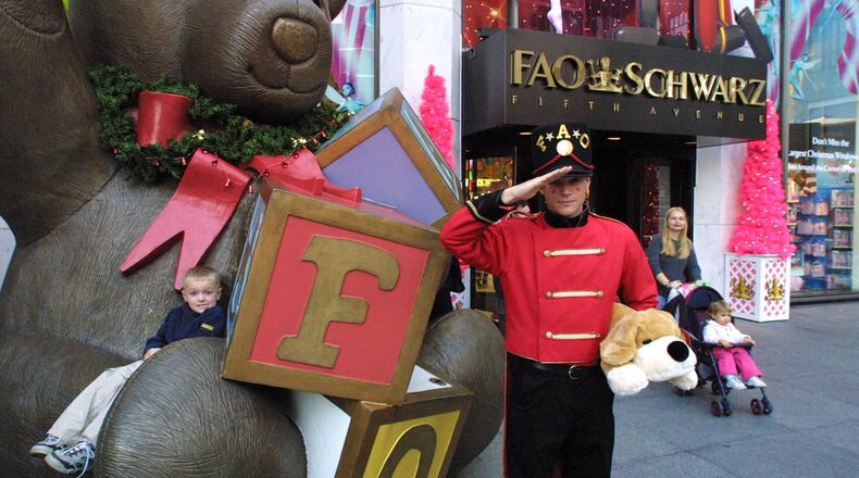 Nicholas Mann, 4, visiting New York with his family from Ohio plays on the FAO Schwarz teddy bear on Fifth Avenue in 2001. (Fred R. Conrad/The New York Times)