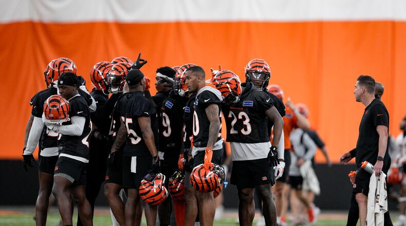 Cincinnati Bengals defensive players huddle during an NFL football practice, Tuesday, June 11, 2024, in Cincinnati. (AP Photo/Jeff Dean)