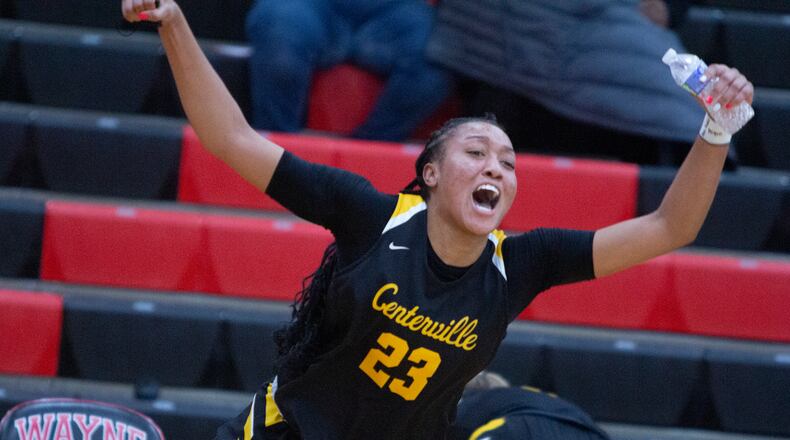 Centerville's Cotie McMahon celebrates the Elks' 66-64 victory at Wayne on Thursday night that gave the Elks a share of the GWOC title with Wayne and Springboro and broke a three-game losing streak against the Warriors. Jeff Gilbert/CONTRIBUTED