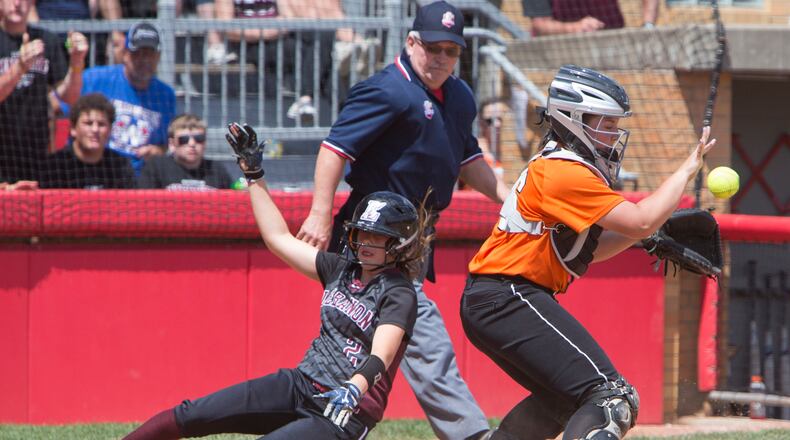 Lebanon’s Kat Frank scores ahead of the throw to North Canton Hoover catcher Laurel DeVoe during the 2017 Division I state semifinal at Firestone Stadium in Akron. ROBERT ROSSITER/THE CANTON REPOSITORY