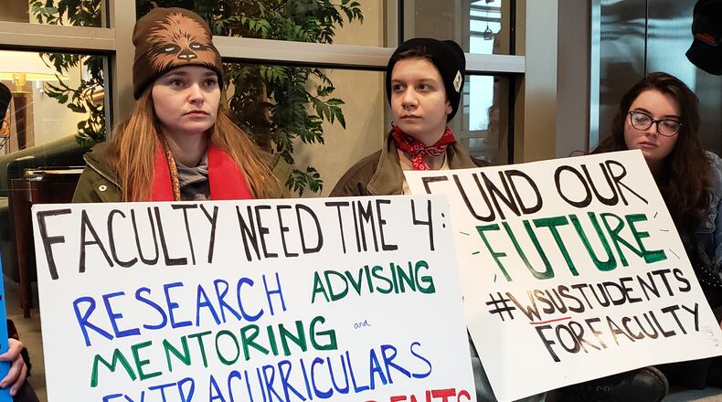Wright State University students protest Thursday outside President Cheryl Schroeder’s office.