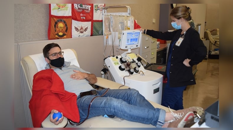 Ryan Monell of Beavercreek is the first to qualify by positive antibody test to give COVID-19 Convalescent Plasma (CCP) at the Community Blood Center. He is shown making a donation in July. The CBC said peak demand has increased the need for people who survived COVID-19 to become a "Crisis Warrior" and donate CCP, which is used to treat critically ill coronavirus patients. CONTRIBUTED