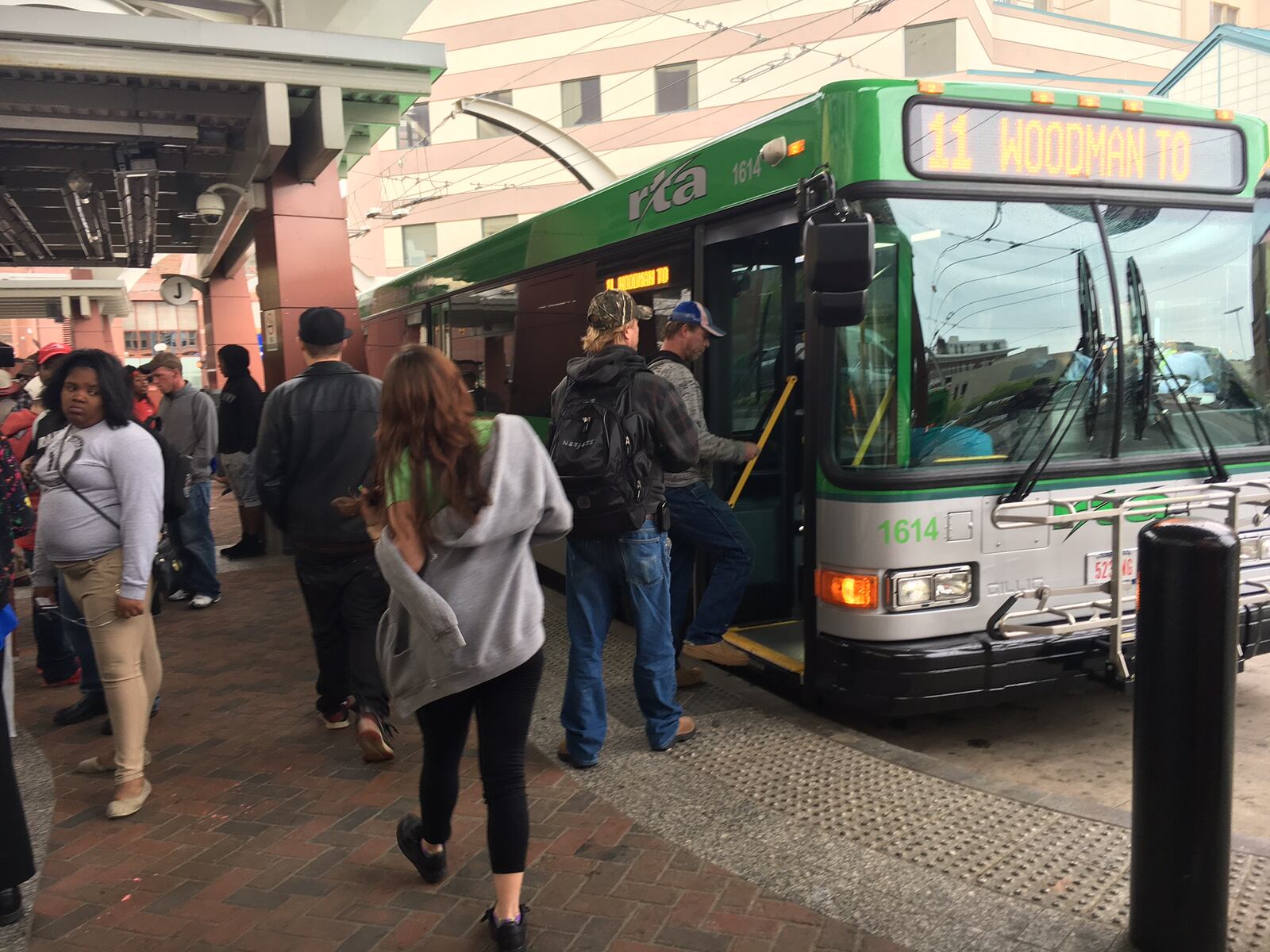 Riders gather to catch buses at the Greater Dayton Regional Transit Authority hub downtown on April 21. JOSH SWEIGART / STAFF