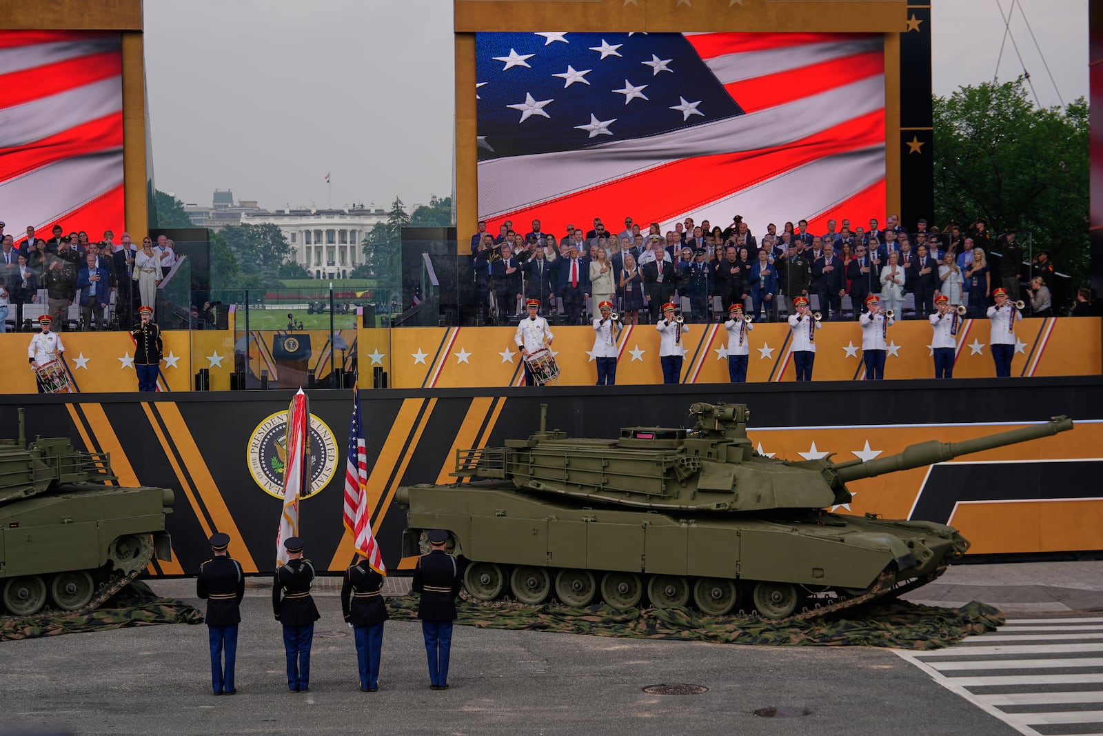 The National Anthem is performed as President Donald Trump attends a military parade commemorating the Army's 250th anniversary, coinciding with his 79th birthday, Saturday, June 14, 2025, in Washington. (AP Photo/Julia Demaree Nikhinson)