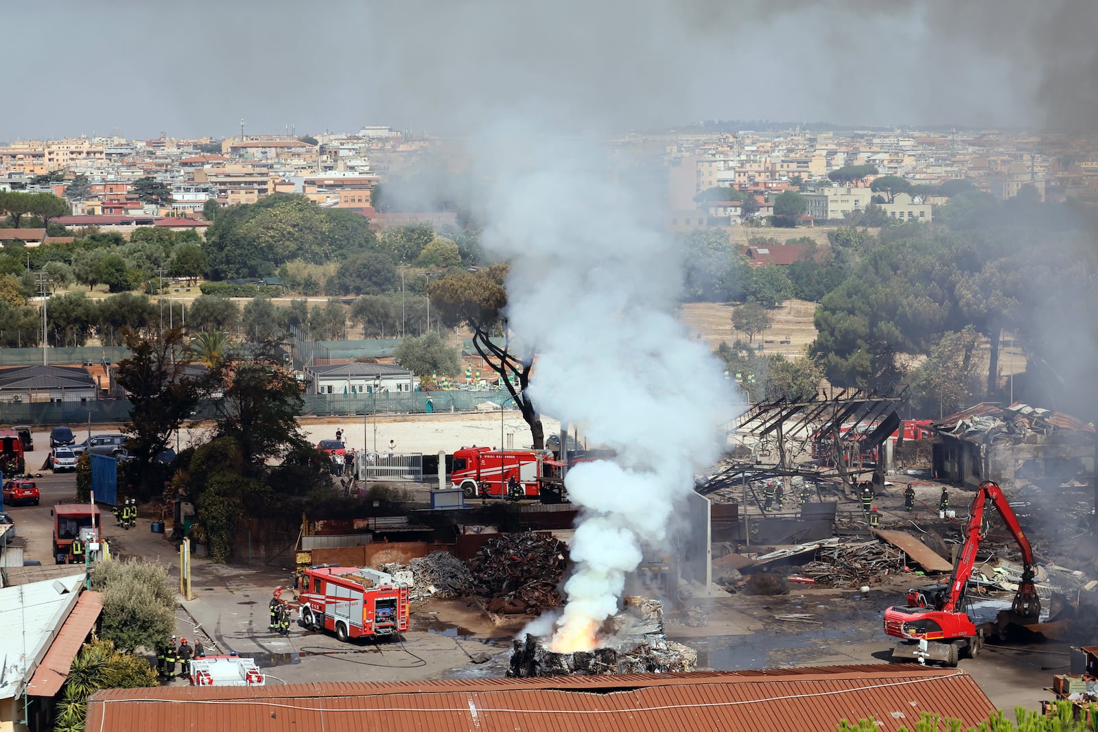 Smoke rises after a gas station exploded on the outskirts of Rome, Friday, July 4, 2025. (Cecilia Fabiano/LaPresse via AP)