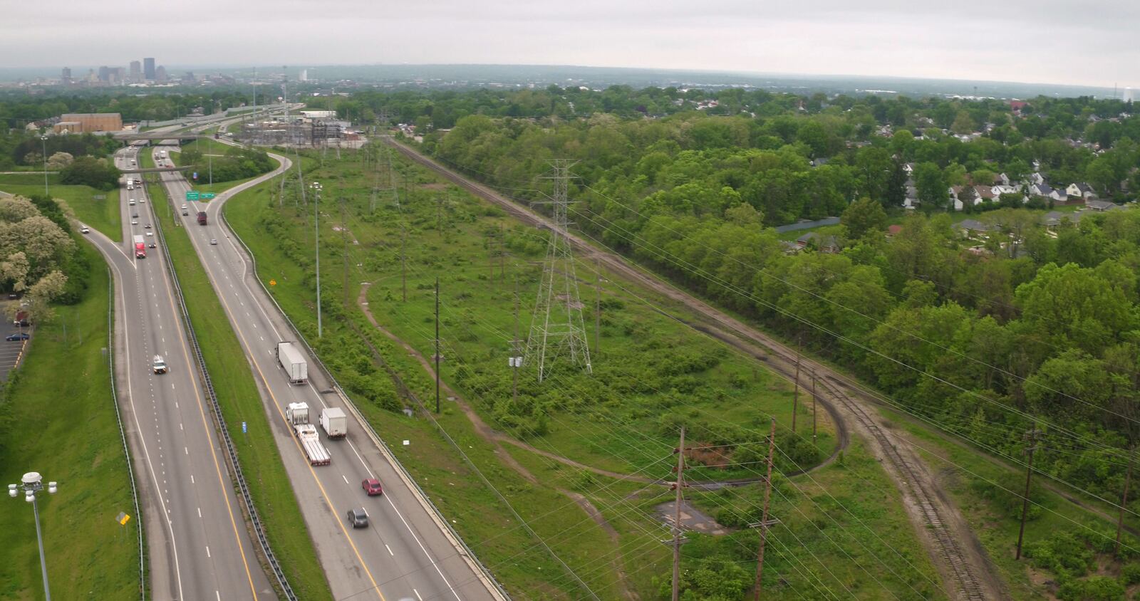 Stretch of unused railway, right,  paralllels U.S.35 in east Dayton.  The City of Dayton is seeking to acquire 6.5 miles of railway from Kettering to downtown Dayton for the creation of "high-line" bikeway and parks.   TY GREENLEES / STAFF