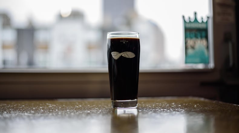 Warped Wing Brewing Company tapped the 10 TON Irish Cream Stout, a special variation of their Oatmeal Stout ahead of St. Patrick's Day at their brewery in downtown Dayton on Saturday, March 9. TOM GILLIAM / CONTRIBUTING PHOTOGRAPHER