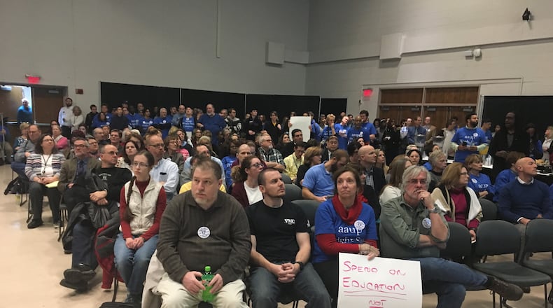 FILE: Members of the Wright State University faculty union protest at a forum on campus in 2018.
