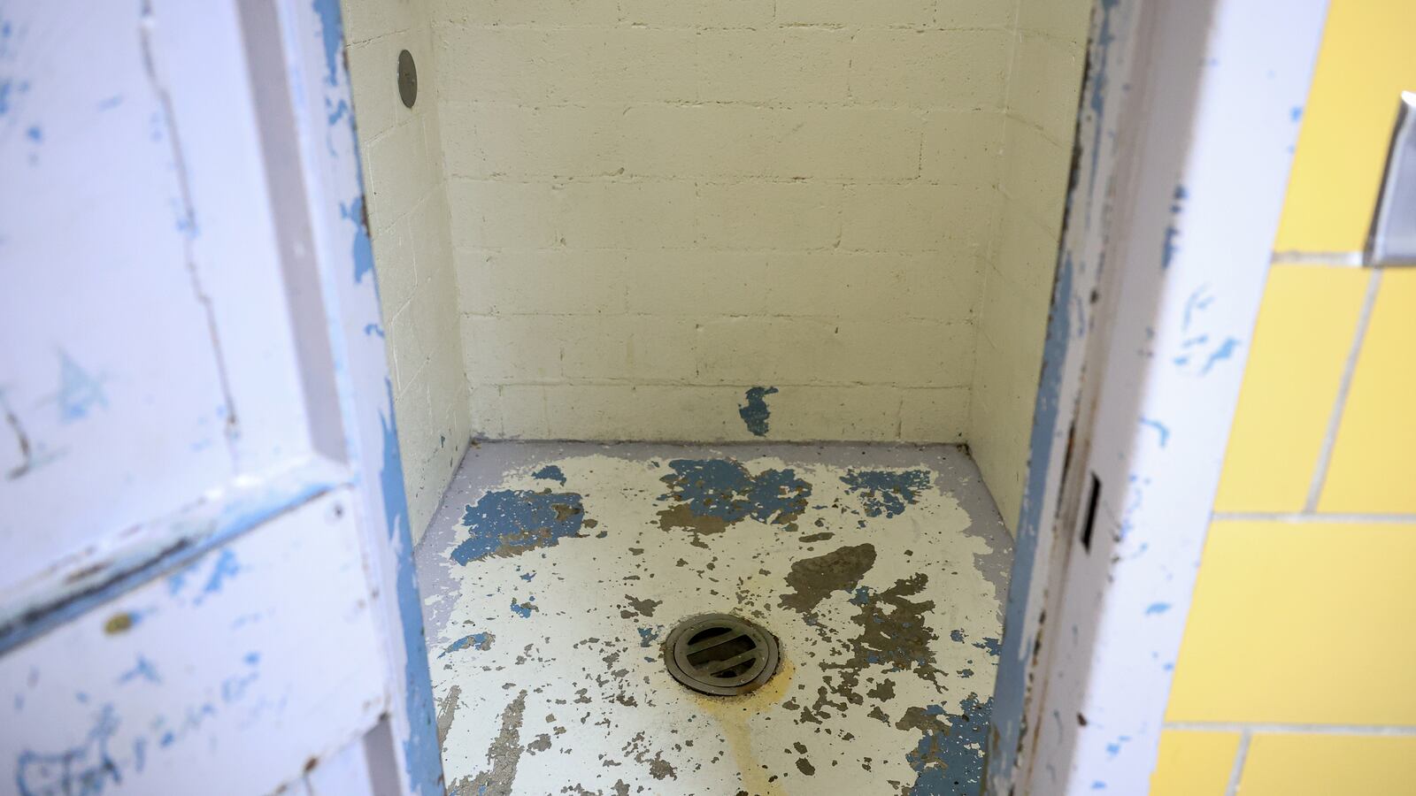 A view looking at the floor of a "suicide cell" in the Miami County Jail, the county's maximum security facility in the safety building in downtown Troy. The drain in the floor is a bathroom for an inmate housed in the cell, though assistant jail administrator Nate Collett said they try to avoid having inmates use it. "Nobody really has these suicide cells anymore. They aren't really a thing," Collett said. BRYANT BILLING / STAFF