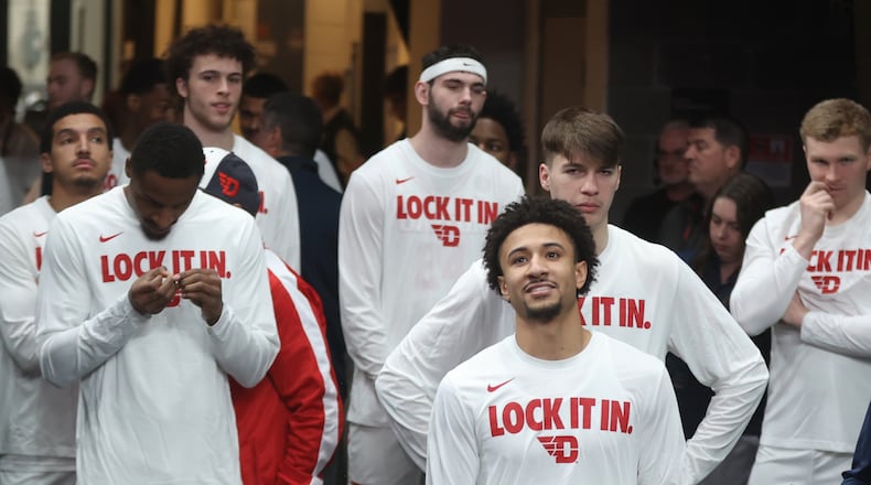 Dayton players, including Javon Bennett, front, wait to take the court before a quarterfinal game against St. Bonaventure in the Atlantic 10 Conference tournament on Friday, March 13, 2026, at PPG Paints Arena in Pittsburgh. David Jablonski/Staff