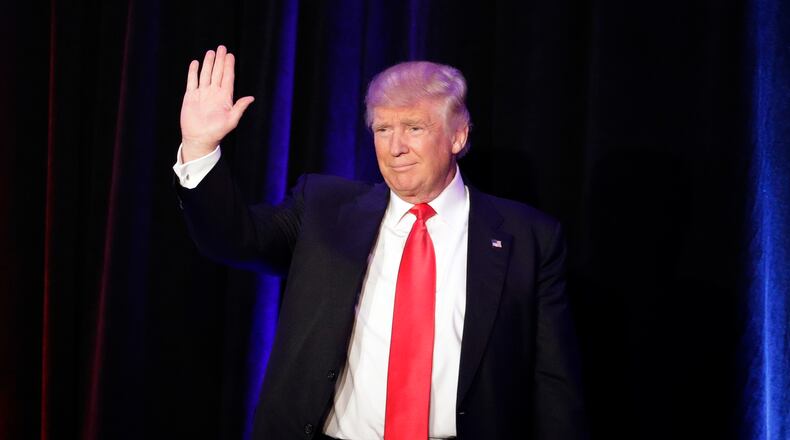 President-elect Donald Trump waves as he arrives at his election night rally, Wednesday, Nov. 9, 2016, in New York. (AP Photo/John Locher)
