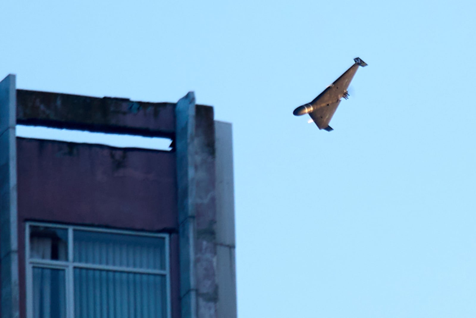 A Russian drone attacks a building during Russia's massive missile and drone air attack in Kyiv, Ukraine, Tuesday, June 17, 2025. (AP Photo/Efrem Lukatsky)