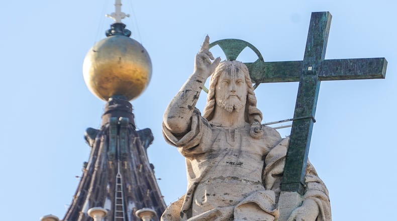 FILE - A statue of Jesus Christ on the facade of St. Peter's Basilica at the Vatican, Nov. 10, 2020. (AP Photo/Andrew Medichini, File)