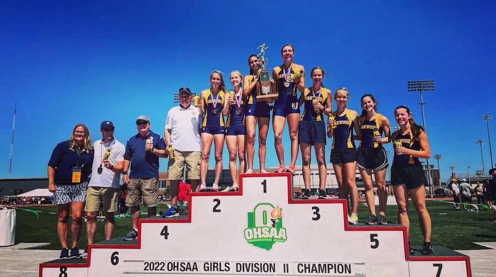 The Oakwood girls track team celebrates a Division II state track championship on June 4, 2022, at Jesse Owens Memorial Stadium in Columbus. David Jablonski/Staff