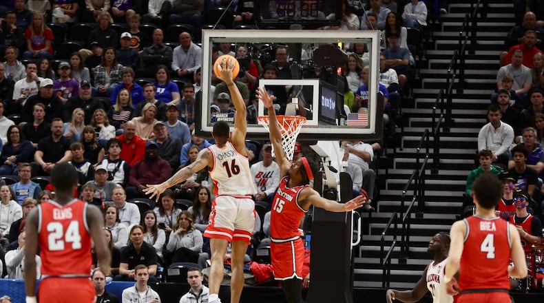 Arizona's Keshad Johnson misses a dunk against Dayton's DaRon Holmes II in the first half in the second round of the NCAA tournament on Saturday, March 23, 2024, at the Delta Center in Salt Lake City, Utah. David Jablonski/Staff