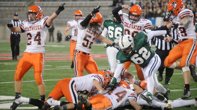 Coldwater’s Brad Giere (24) and Cody Giere (54) signal a fumble recovery. Coldwater played Canton Central Catholic in the D-V high school football state championship at Ohio Stadium on Saturday, Dec. 3, 2016. MARC PENDLETON / STAFF
