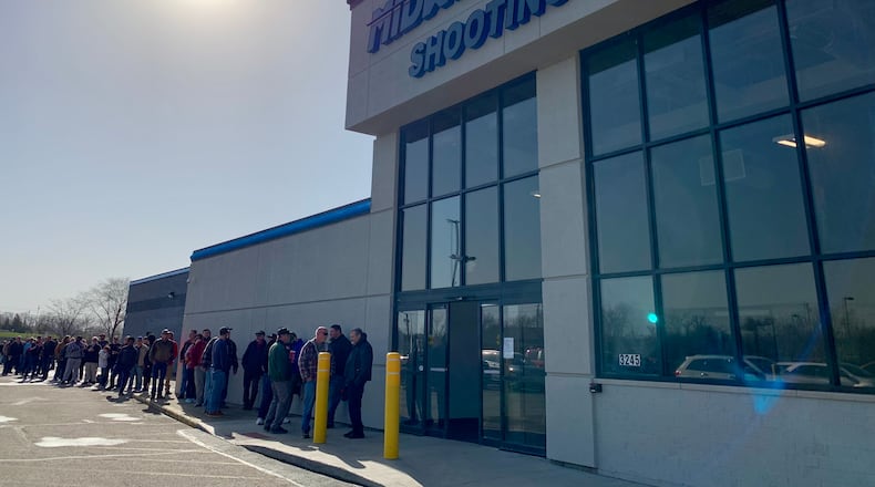 Shooting sports enthusiasts were lined up outside Midwest Shooting Center in Beavercreek for its opening Saturday morning. LONDON BISHOP/STAFF