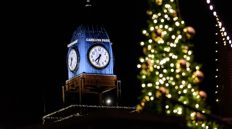 Carillon Historical Park celebrated its 75th anniversary and the 30th annual Ringing in the Holidays on Saturday, Nov. 22, 2025. This year, the privately funded nonprofit’s seasonal fundraiser debuted as the official preview party for A Carillon Christmas, the park’s month-long celebration that runs until Dec. 30. Guests enjoyed live carolers, bell wagon concerts by carillonneur Alan Bowman, a silent auction, festive foods and specialty cocktails served throughout the museum’s exhibits, including a martini ice luge. TOM GILLIAM/CONTRIBUTING PHOTOGRAPHER