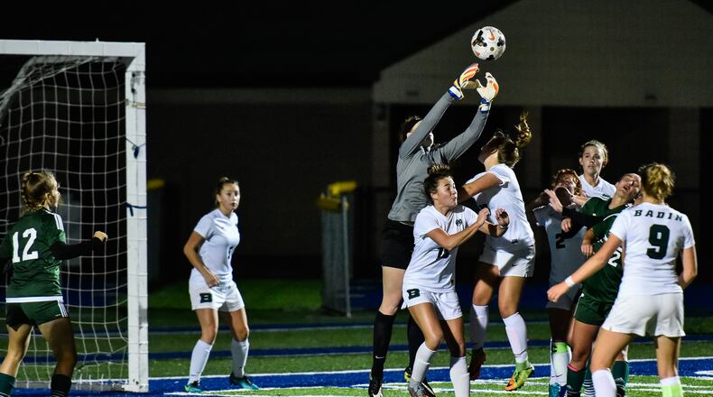 Badin goalkeeper Mackayla Kowalski jumps up to grab the ball during a 2017 Division II sectional final soccer game. NICK GRAHAM/STAFF