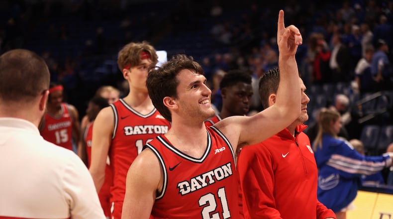 Dayton's Brady Uhl reacts after seeing his friends, who had painted his last name on their chests, in the stands after a victory against Saint Louis on Tuesday, March 5, 2024, at Chaifetz Arena in St. Louis, Mo. David Jablonski/Staff