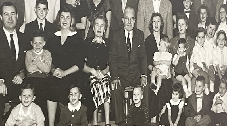 George Walther, Sr., started the Dayton Steel Foundry more than 100 years ago. He is seen here near the middle with a suit and tie surrounded by employees and family members in a photo taken in the 1950s. NICK BLIZZARD/STAFF