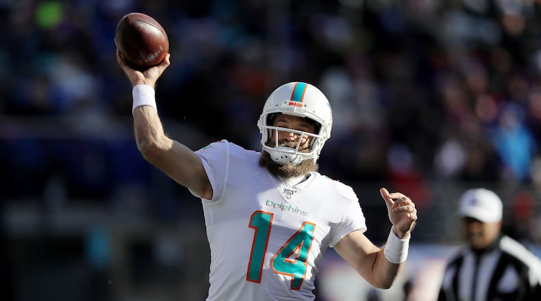 EAST RUTHERFORD, NEW JERSEY - DECEMBER 15: Ryan Fitzpatrick #14 of the Miami Dolphins passes the ball in the first quarter against the New York Giants at MetLife Stadium on December 15, 2019 in East Rutherford, New Jersey. (Photo by Elsa/Getty Images)