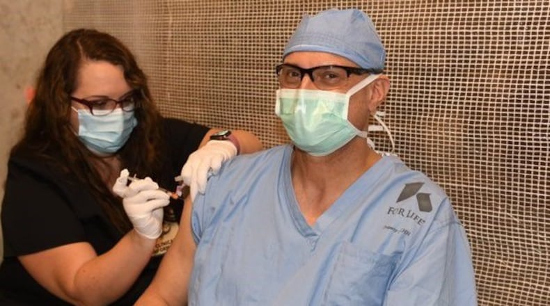 Kettering Health Network surgeon Dr. Brian Ondulick received his first dose of the Moderna vaccine Monday at Soin Medical Center in Beavercreek.