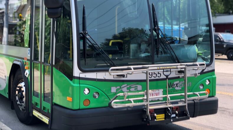 A Greater Dayton RTA bus makes a stop on East Third Street. CORNELIUS FROLIK / STAFF