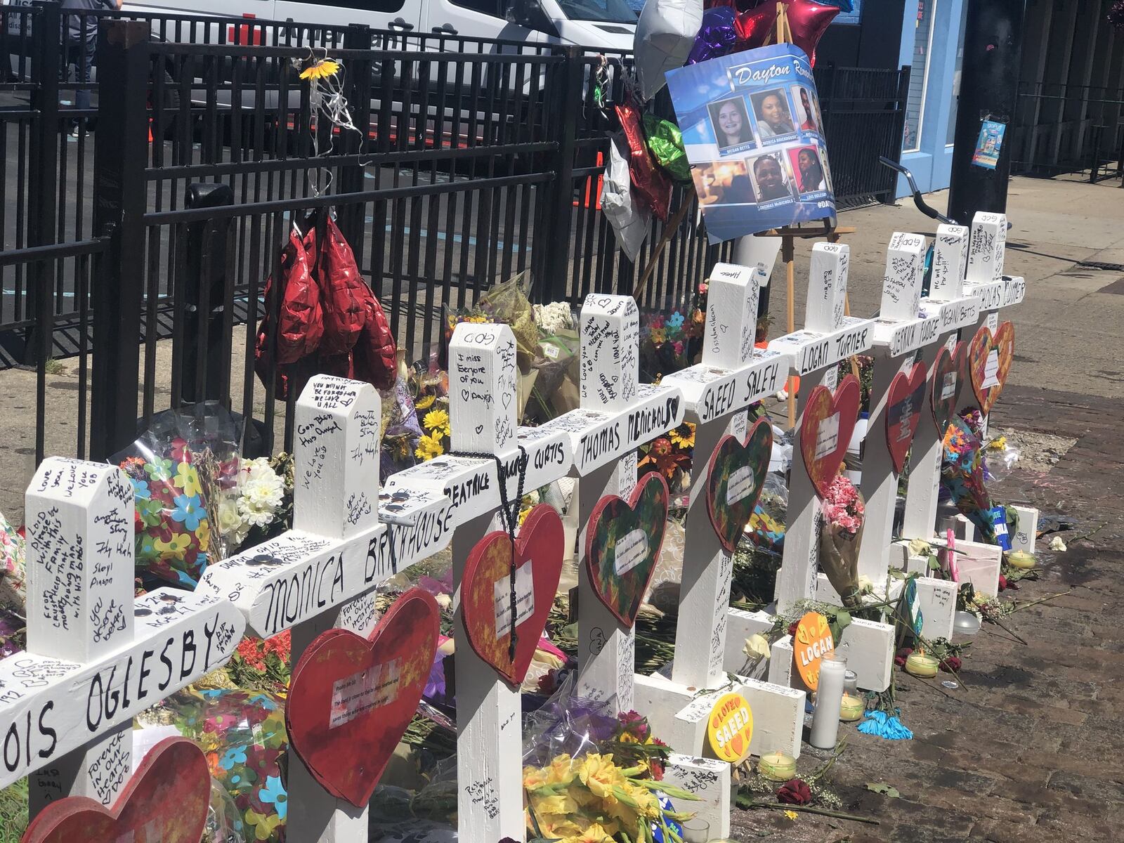 A temporary memorial to the nine people killed in the Aug. 4 shooting in the Oregon District. CORNELIUS FROLIK / STAFF